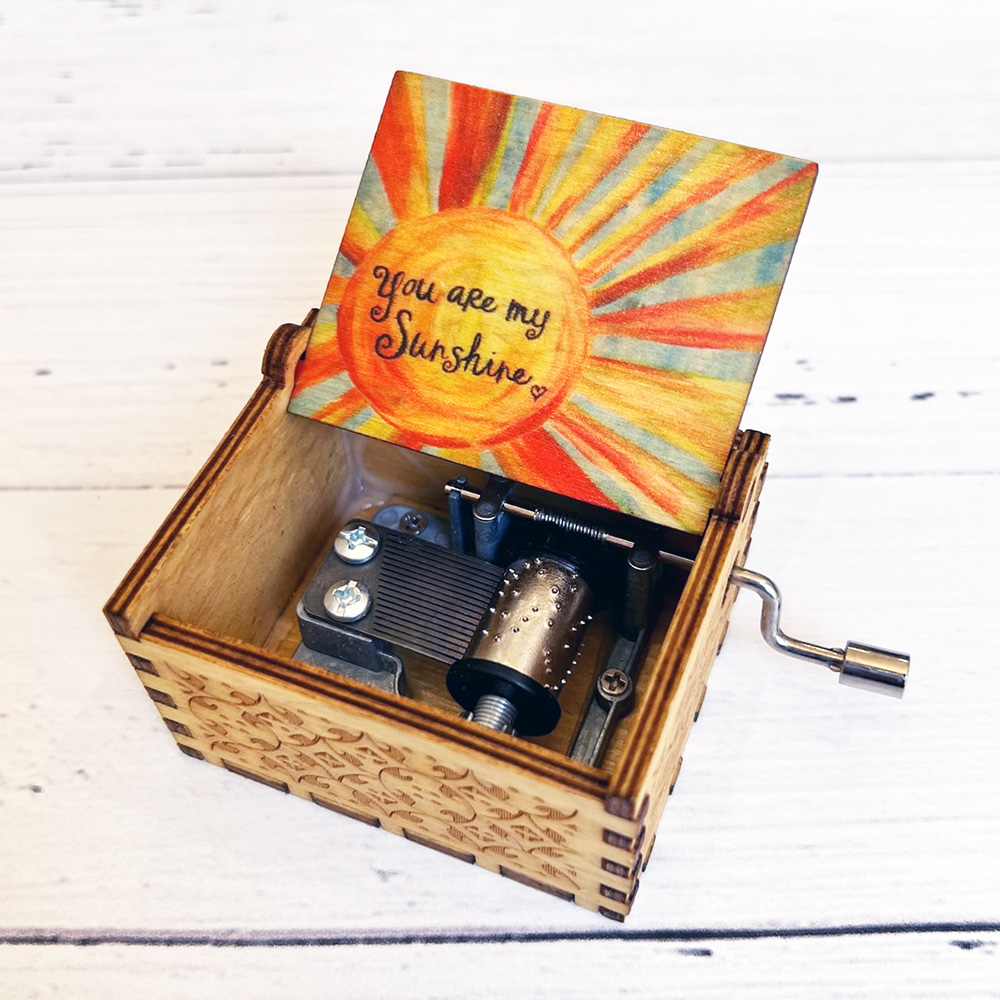 Hand Crank music box playing You Are My Sunshine