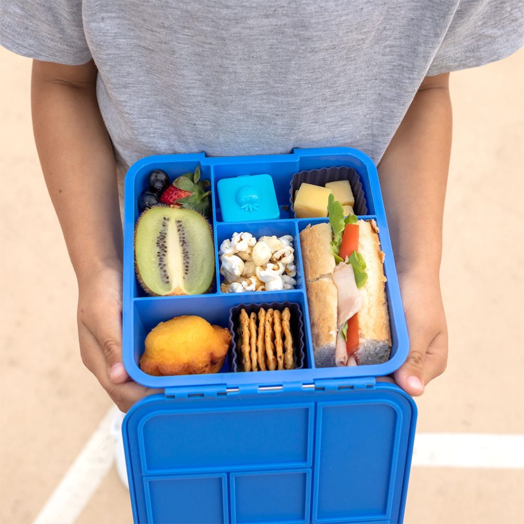 Little Lunch Box Co Bento Five with food in it and extra bento cups